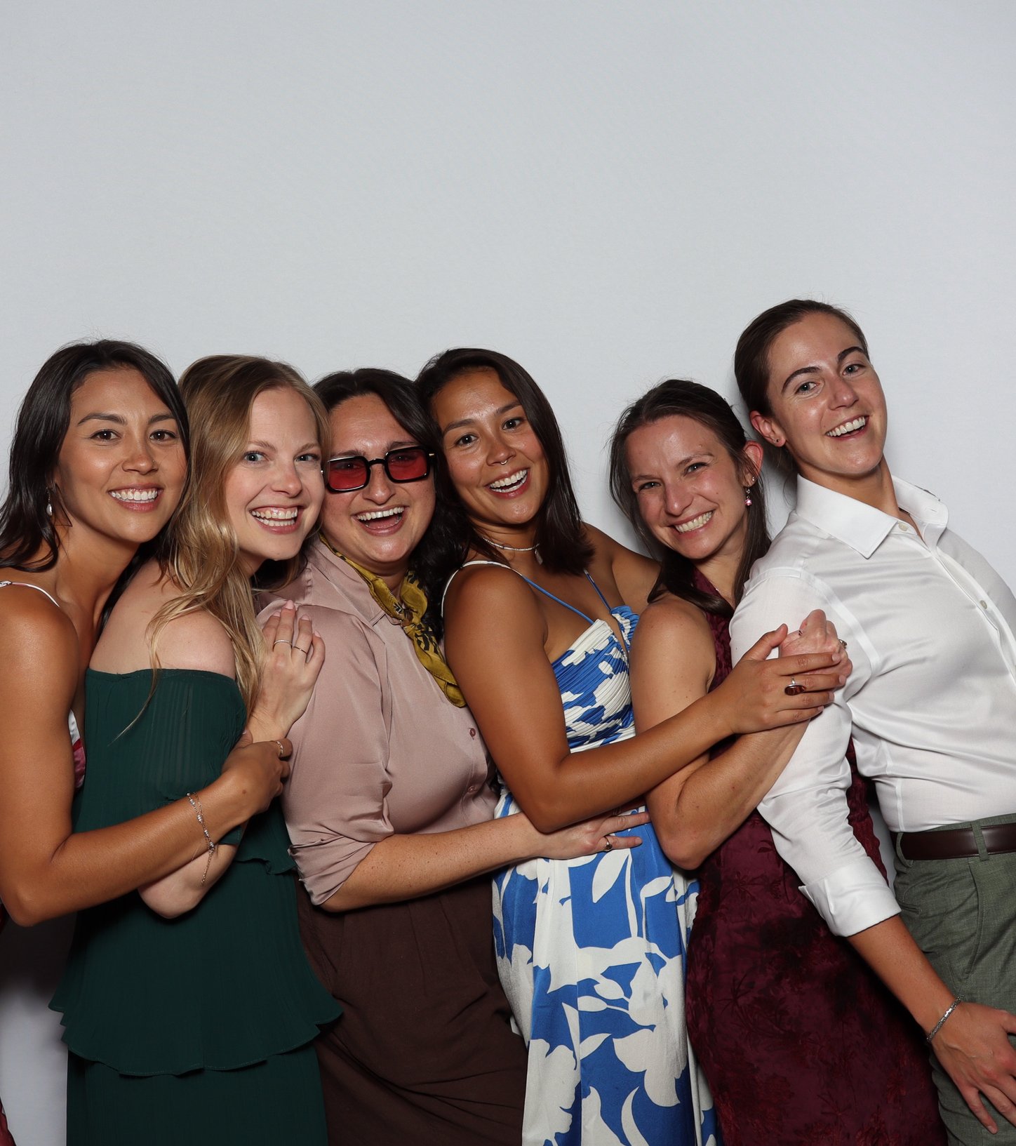 Six friends squeezed into one booth photo