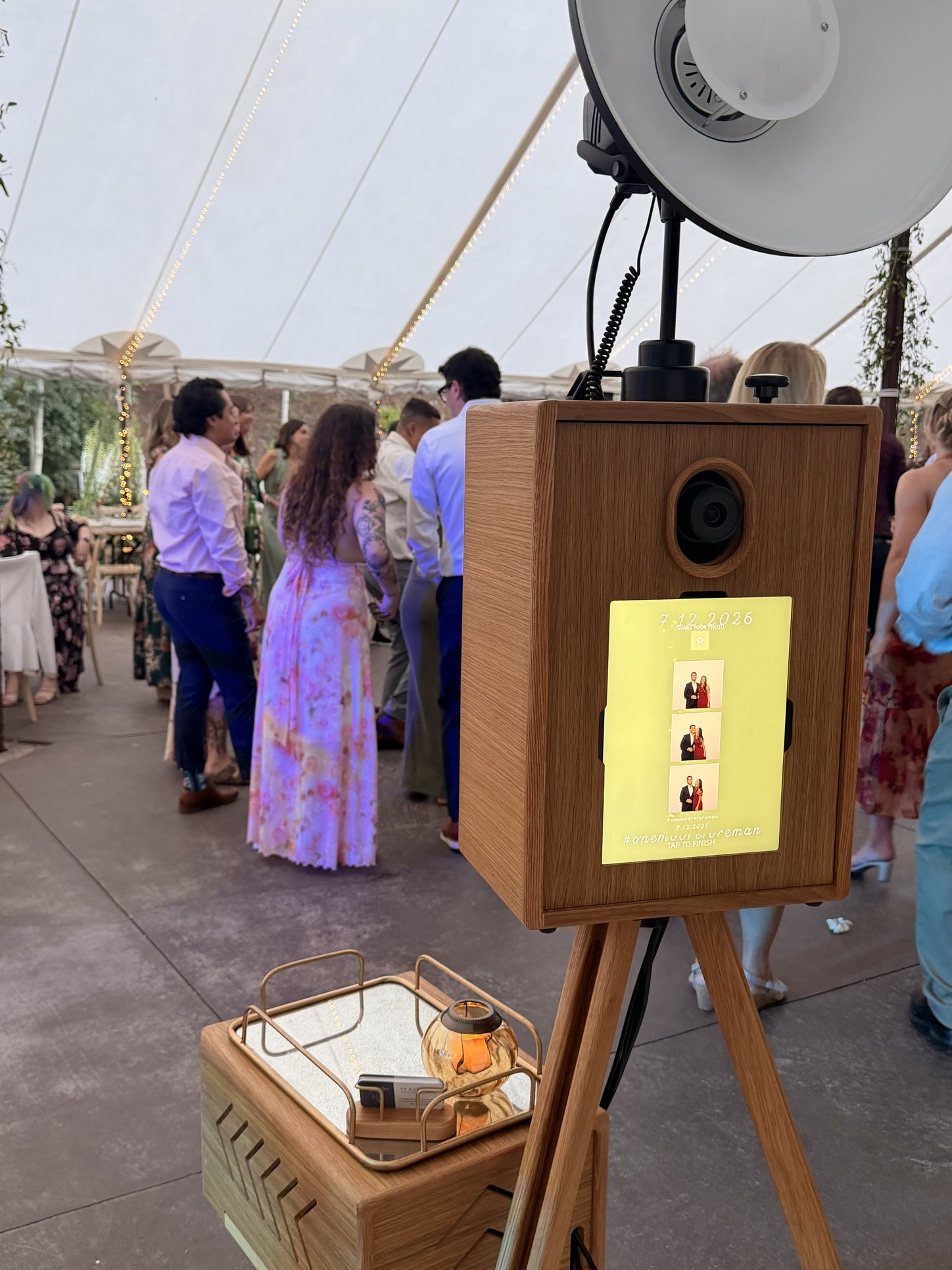 The booth at a tented wedding reception
